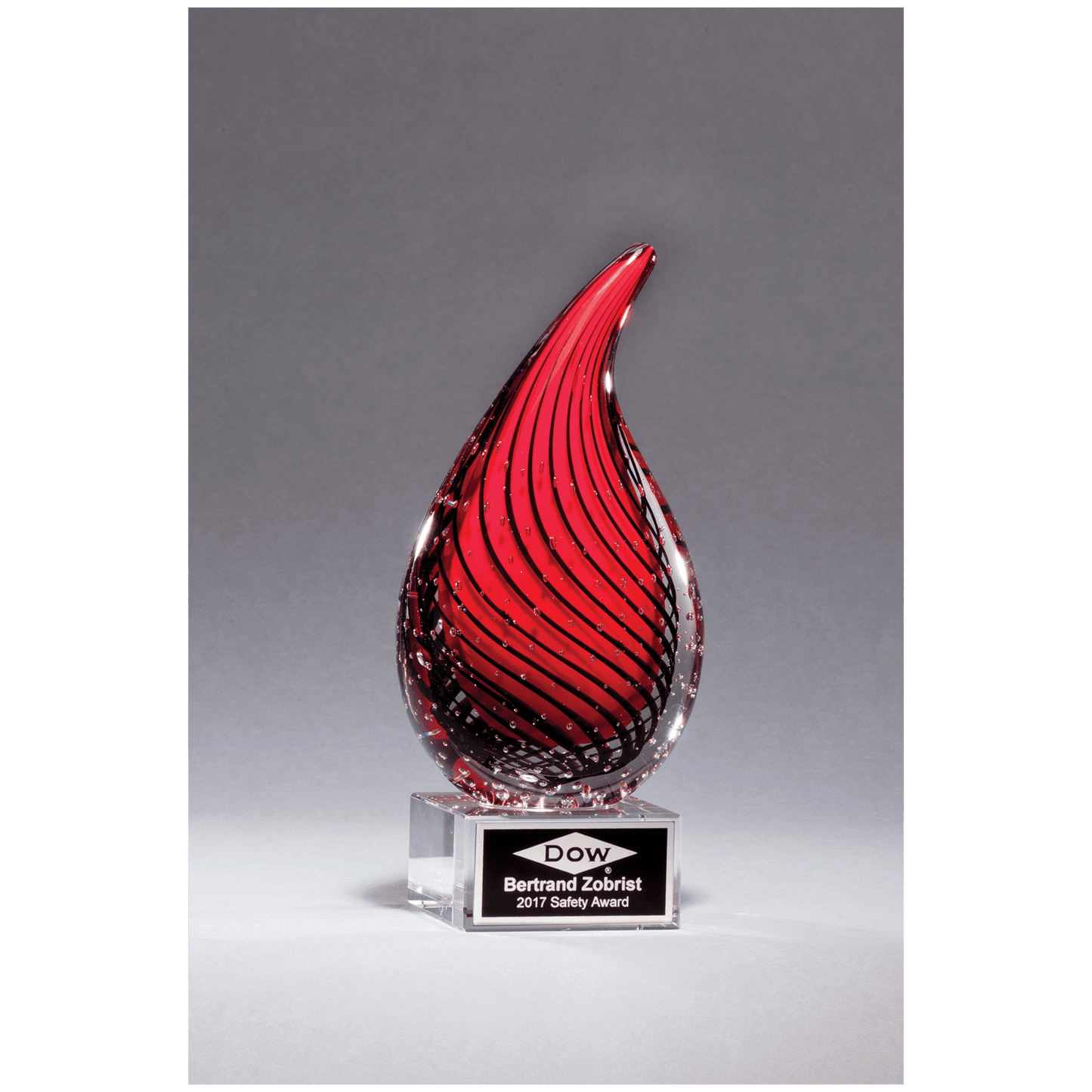 Red Teardrop Art Glass on Clear Glass Base with Black Aluminum Plate