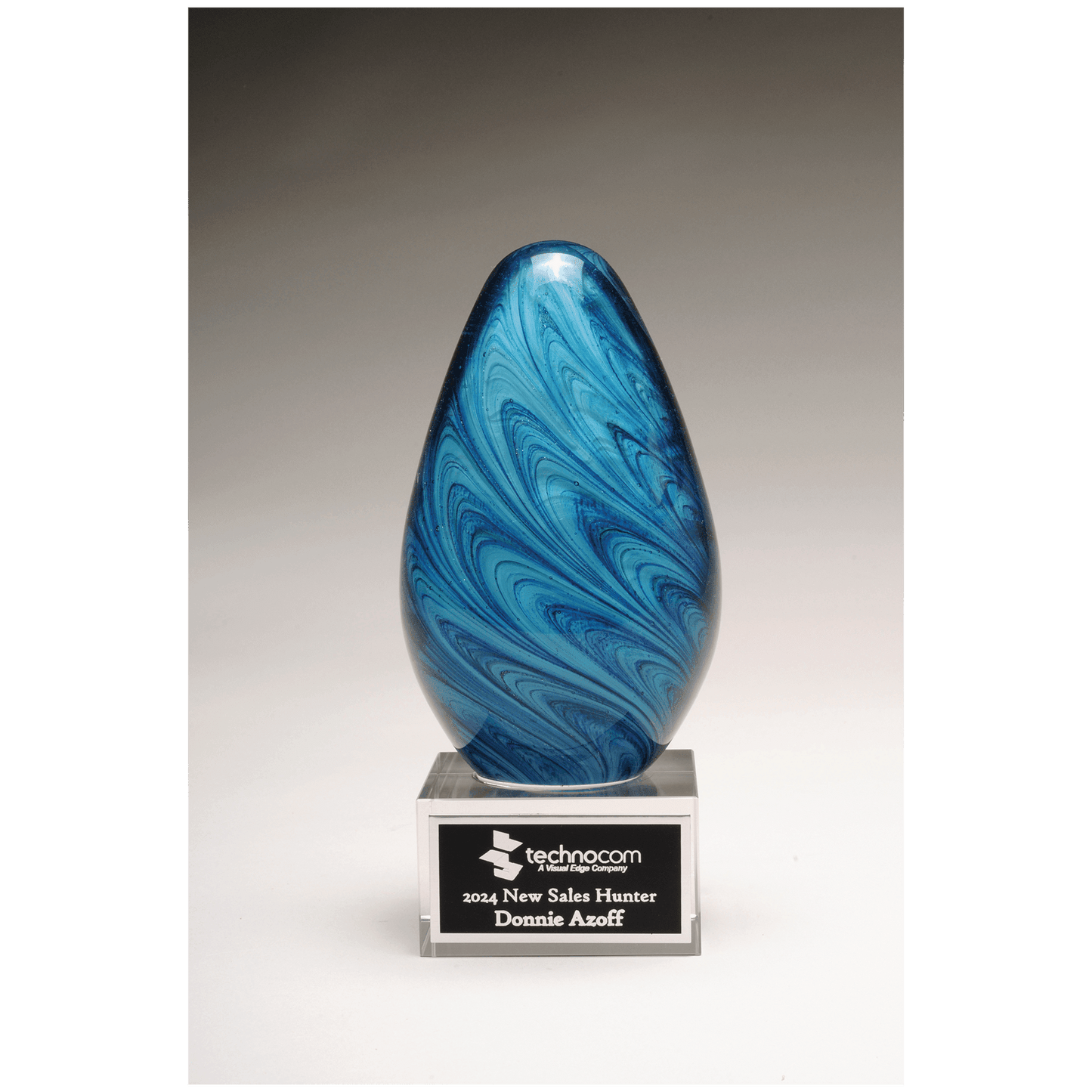 Blue and Green Egg Shaped Art Glass on Clear Glass Base with Black Aluminum Plate